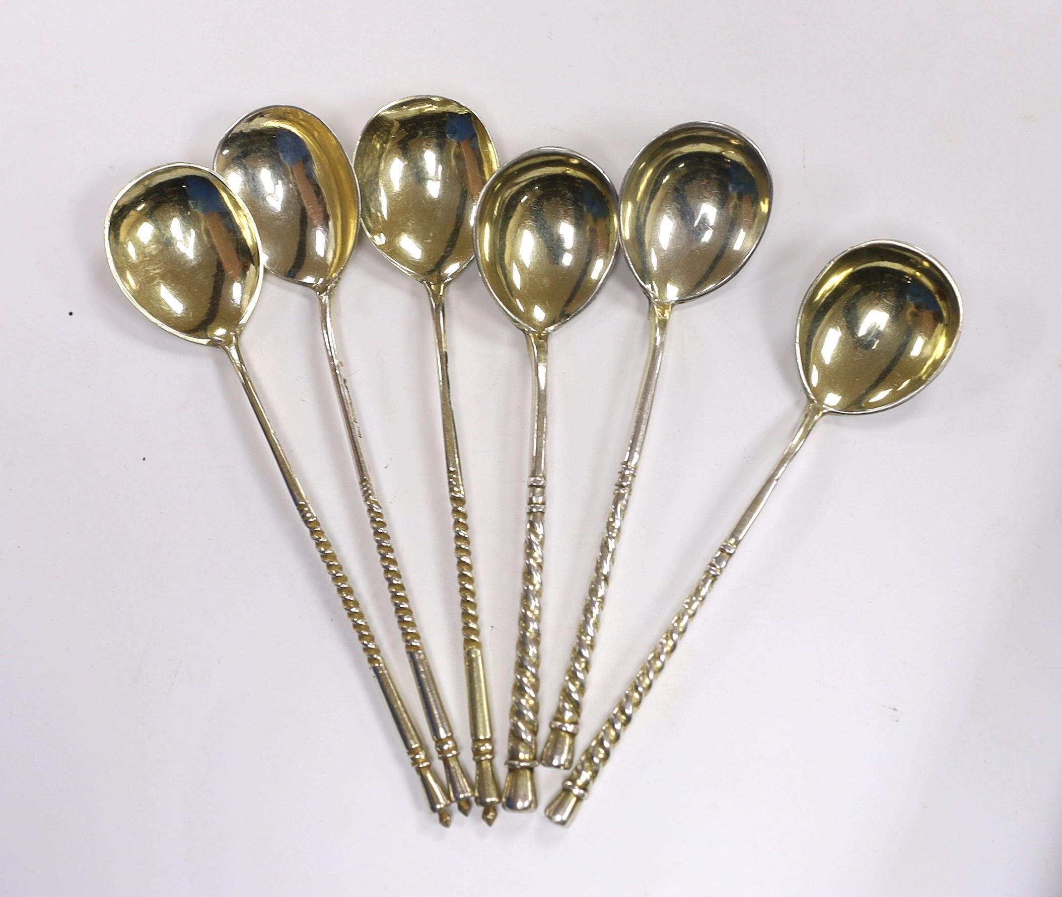 Three 19th century Russian 84 zolotnik and niello teaspoons, 1867 and three similar parcel silver gilt teaspoons, 12.8cm, gross 91 grams.